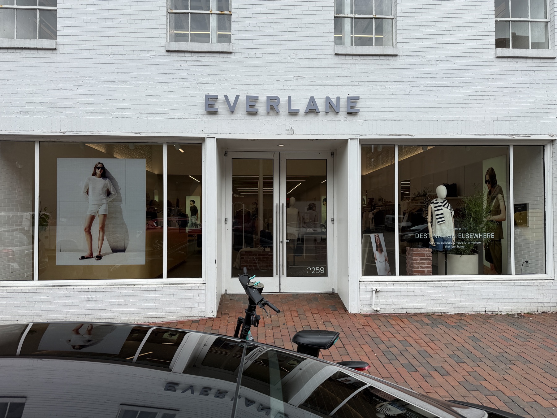 Dimensional letters installed on a painted brick storefront