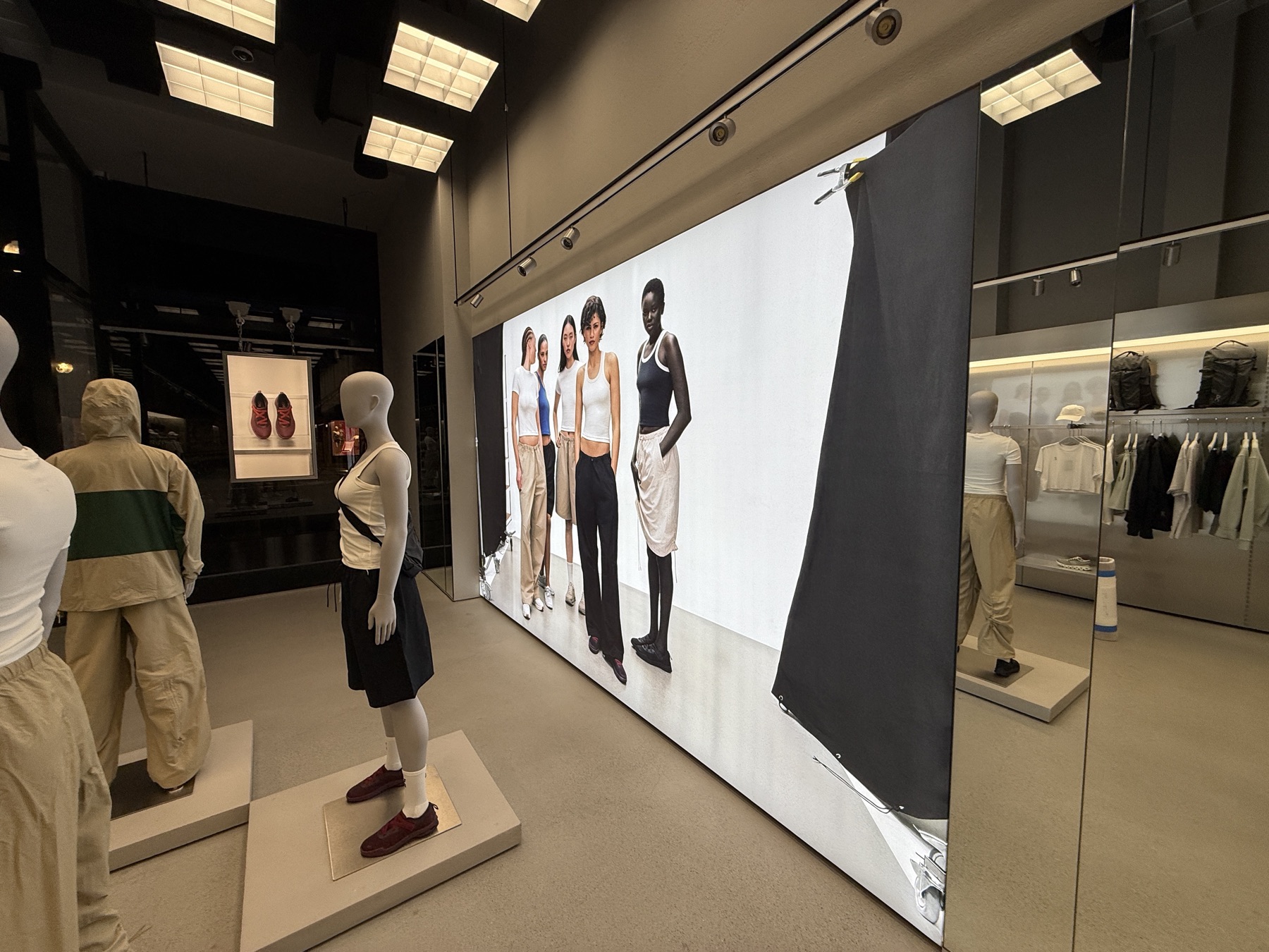 Backlit fabric lightbox wall installed in a retail interior