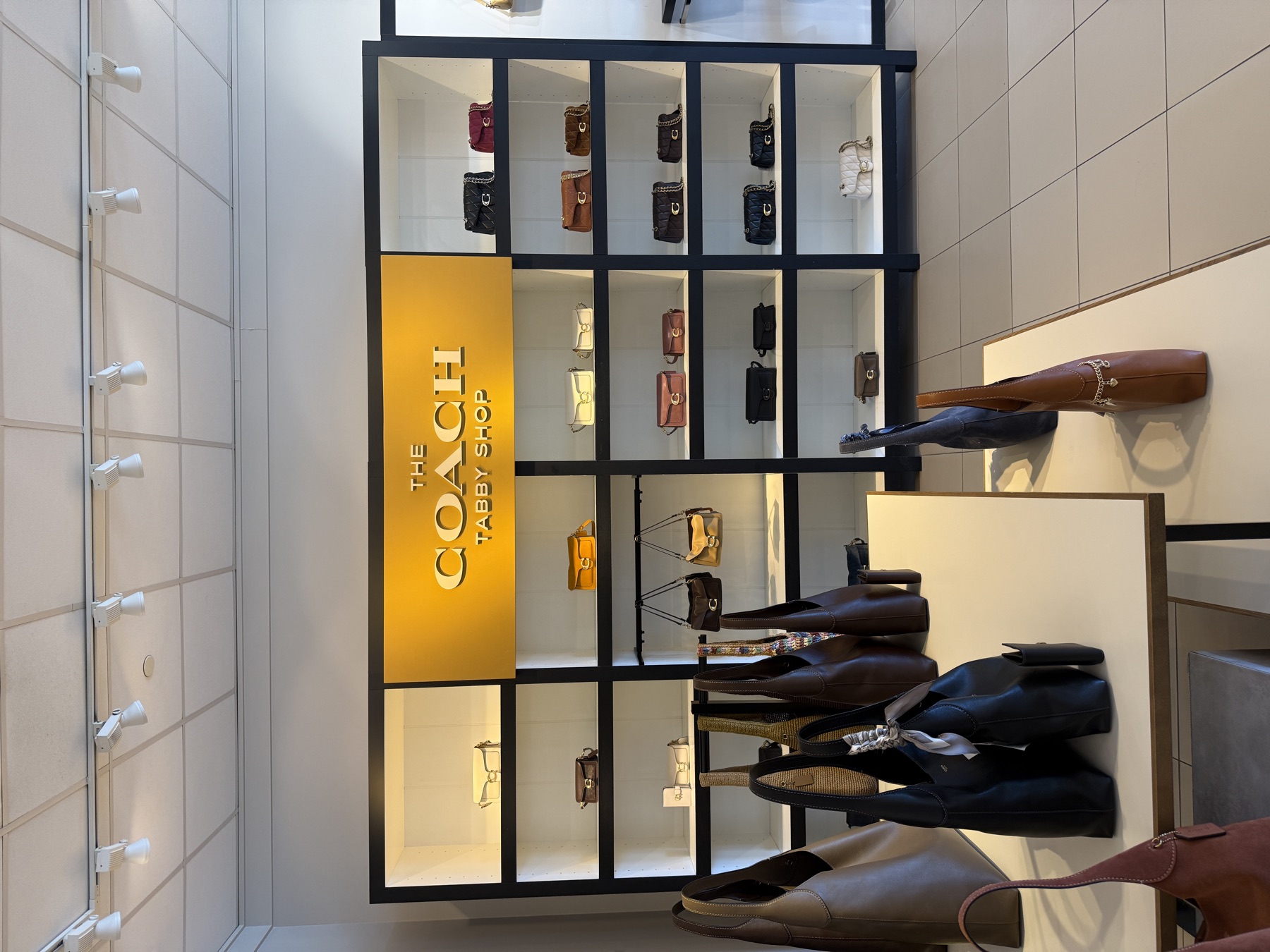 Dimensional brand display installed in a retail interior