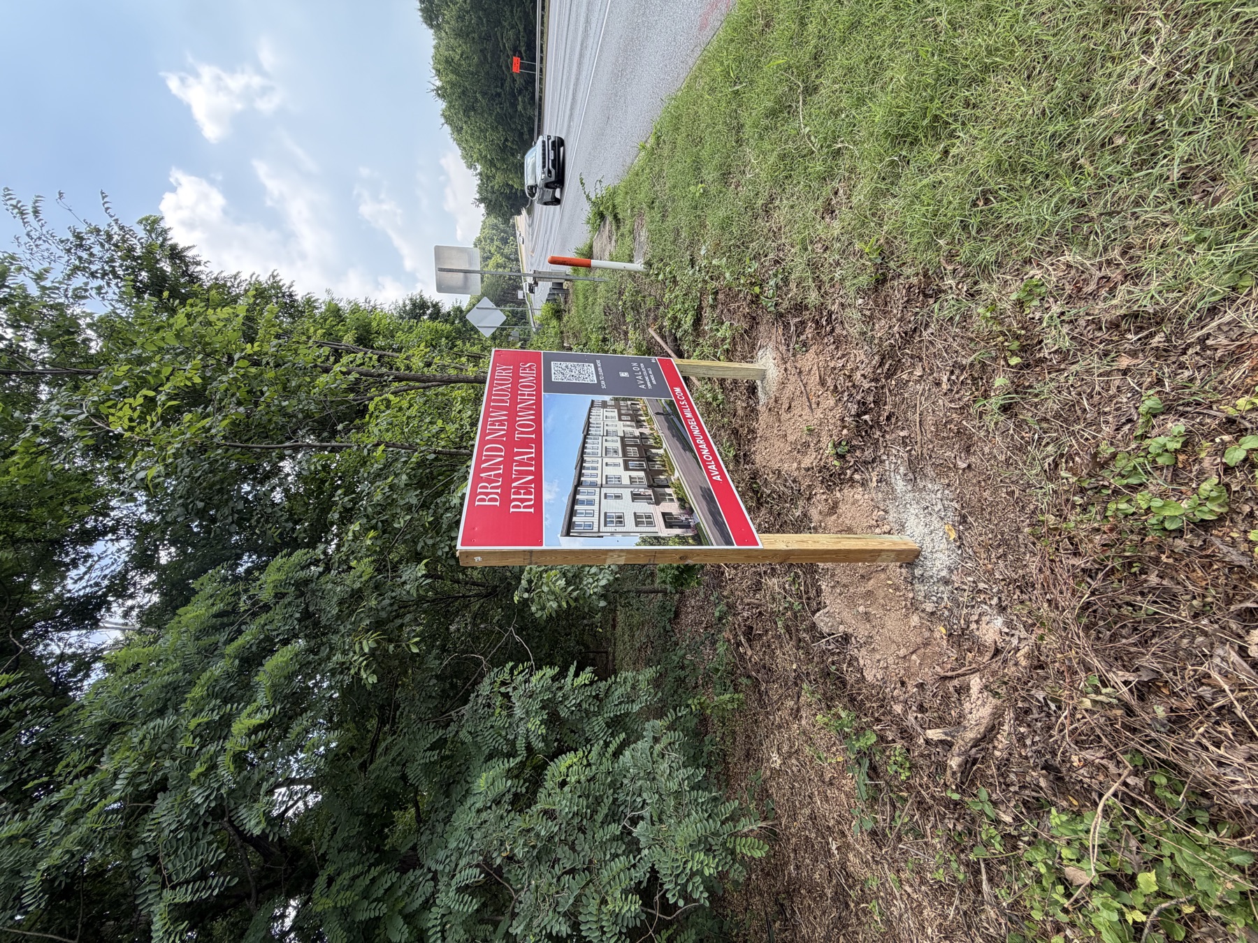 Post-and-panel site sign installed at a development site